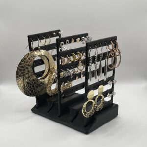 Earrings Holder with earrings on it in the color black