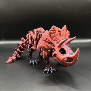 Articulated skeleton Triceratops in the color red/black